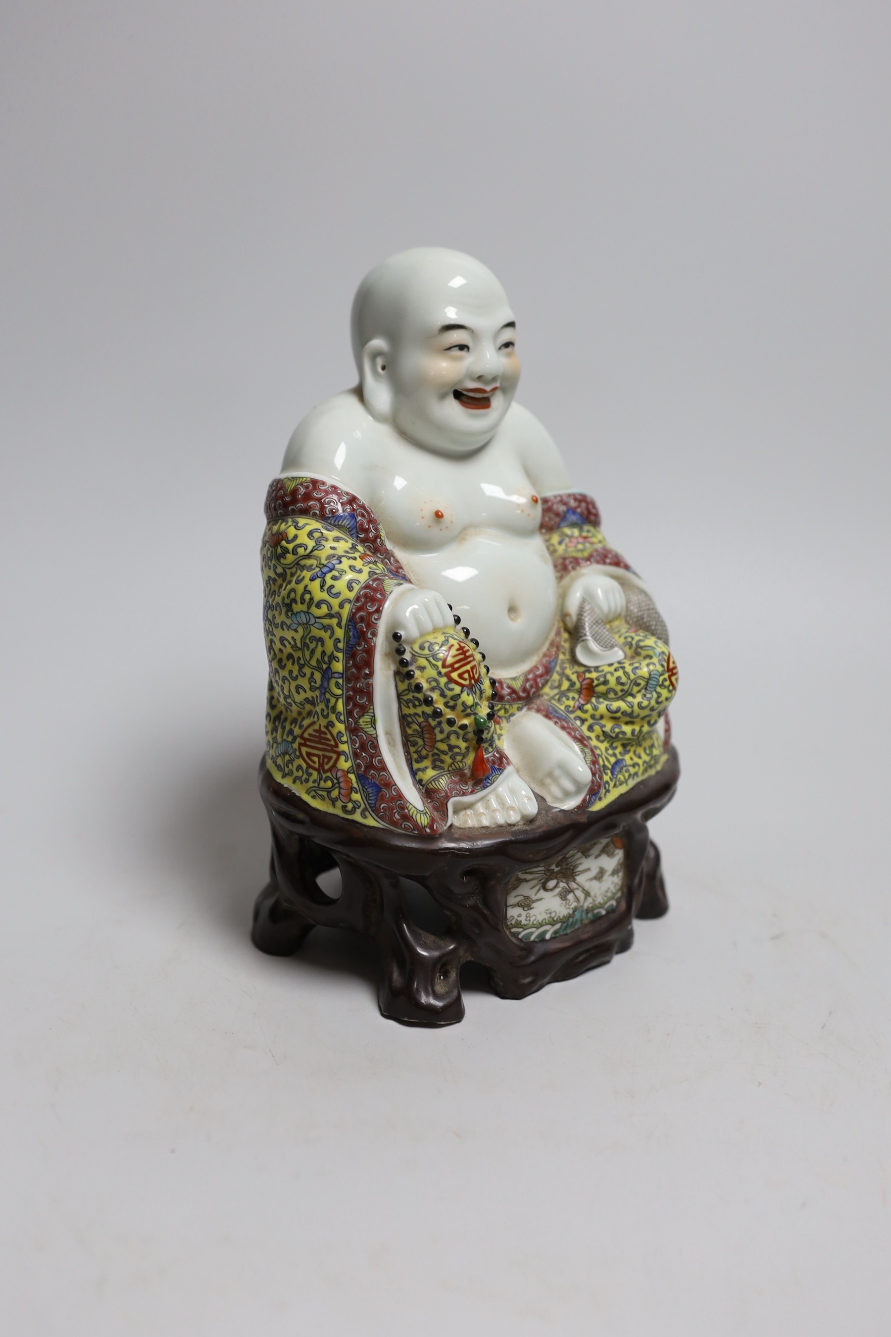 A Chinese enamelled porcelain figure of Budai, 20cm high